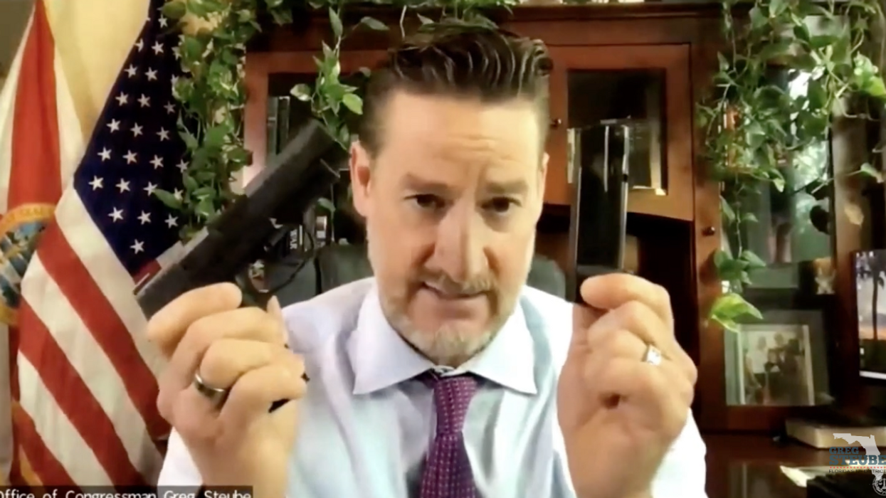 Democrats freak out as GOP Rep displays guns that would be banned under new legislation. When questioned, he snaps back: 'I'm at my house, I can do whatever I want with my guns'
