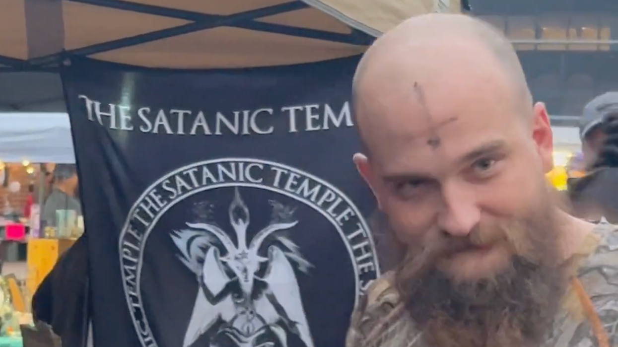 Video: People get inverted cross symbols on foreheads, recite 'Hail Satan' during 'unbaptism' ritual at Pagan Pride Fest