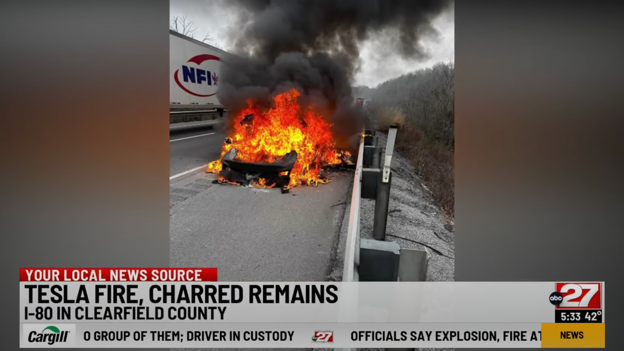 Firefighters dump thousands of gallons of water battling blaze as Tesla burns to smithereens