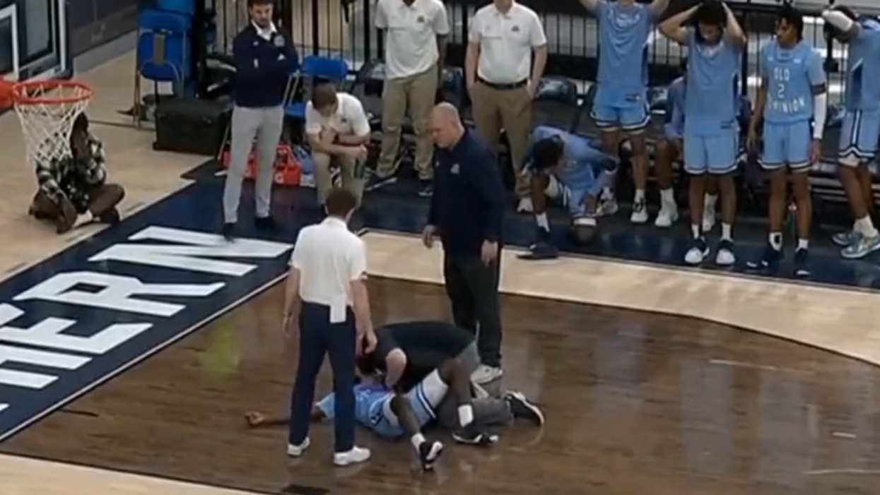 NCAA player collapses on court during basketball game