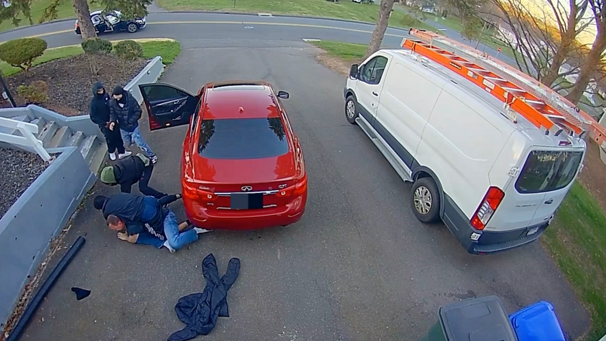 Video: Man fights off four suspected would-be car thieves in his driveway