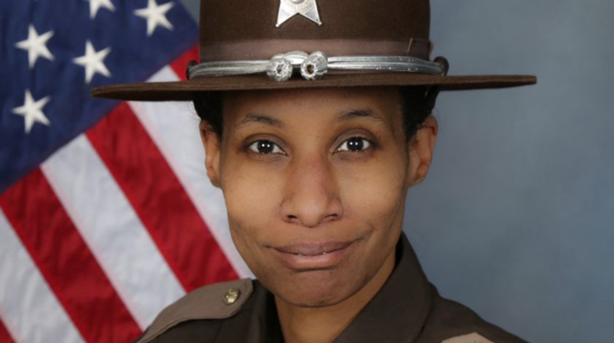 Indiana sheriff's deputy mauled to death in dog attack while protecting 8-year-old son from 'pit bull-type' dog she was dog-sitting