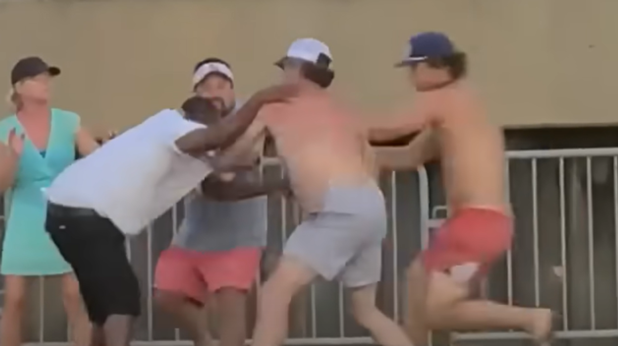 Viral video shows rowdy brawl break out on Alabama dock, man hit over the head with chair, woman thrown into water