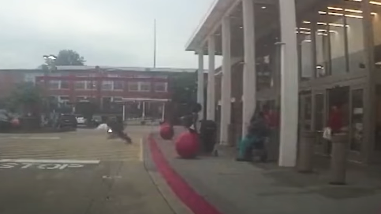 Police bodycam video shows Atlanta cop making football tackle on shoplifter accused of stealing big-screen TVs from Target: 'I don’t want to go to f***ing jail!'