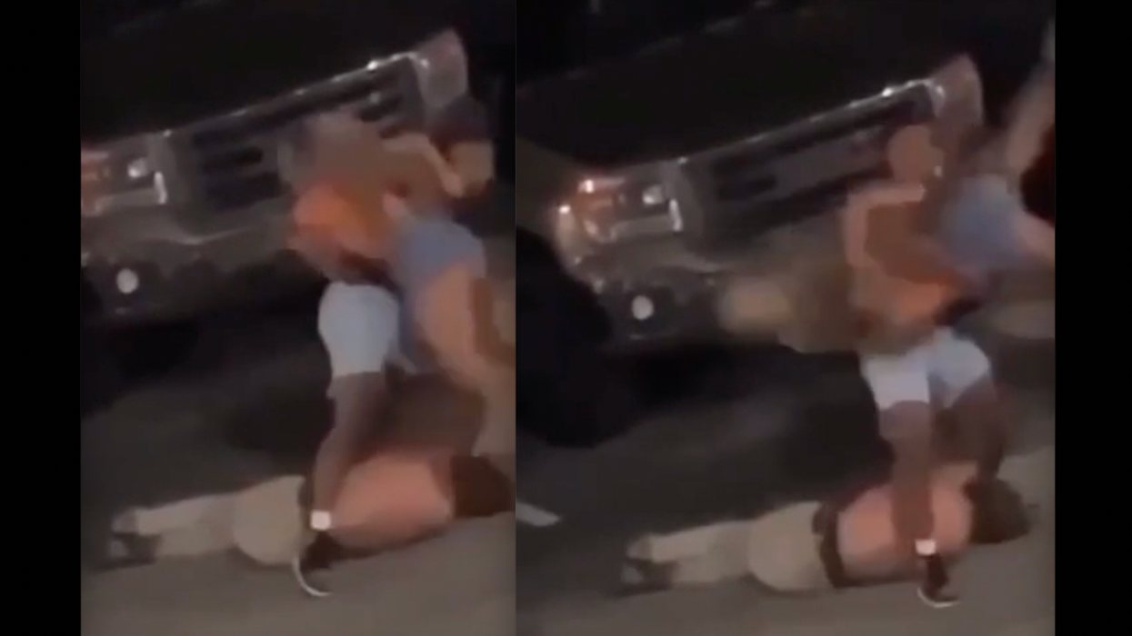 Video: Male brutally body-slams female on parking lot surface after she tries to end attacker's beatdown of another male