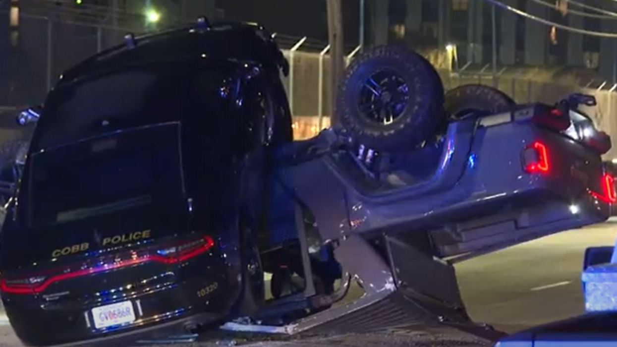 Atlanta police chase ends with cop car on top of suspect's crushed, overturned Jeep
