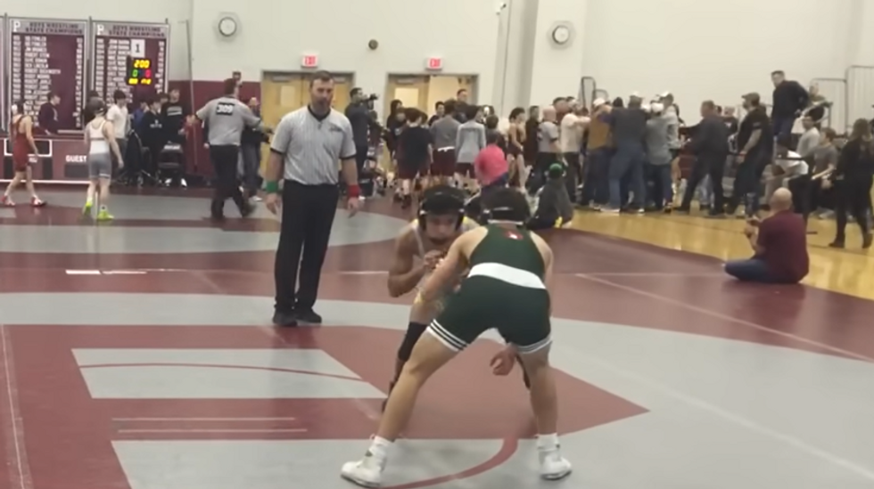 Watch: Shocking‚ bleacher-clearing brawl between parents erupts in the middle of high school wrestling match