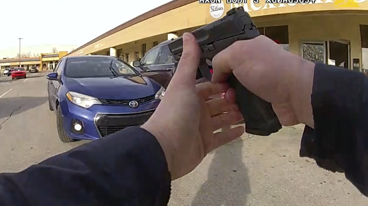 Wild police bodycam video shows Ohio cop getting plowed by stolen vehicle, firing shots at suspect from hood of the car