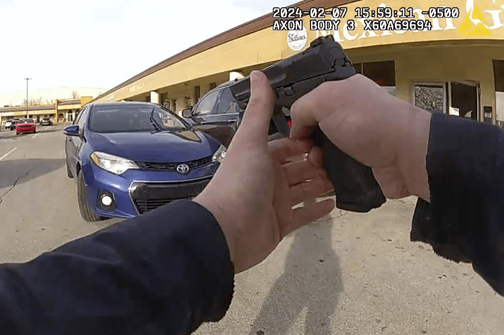 Wild police bodycam video shows Ohio cop getting plowed by stolen vehicle‚ firing shots at suspect from hood of the car