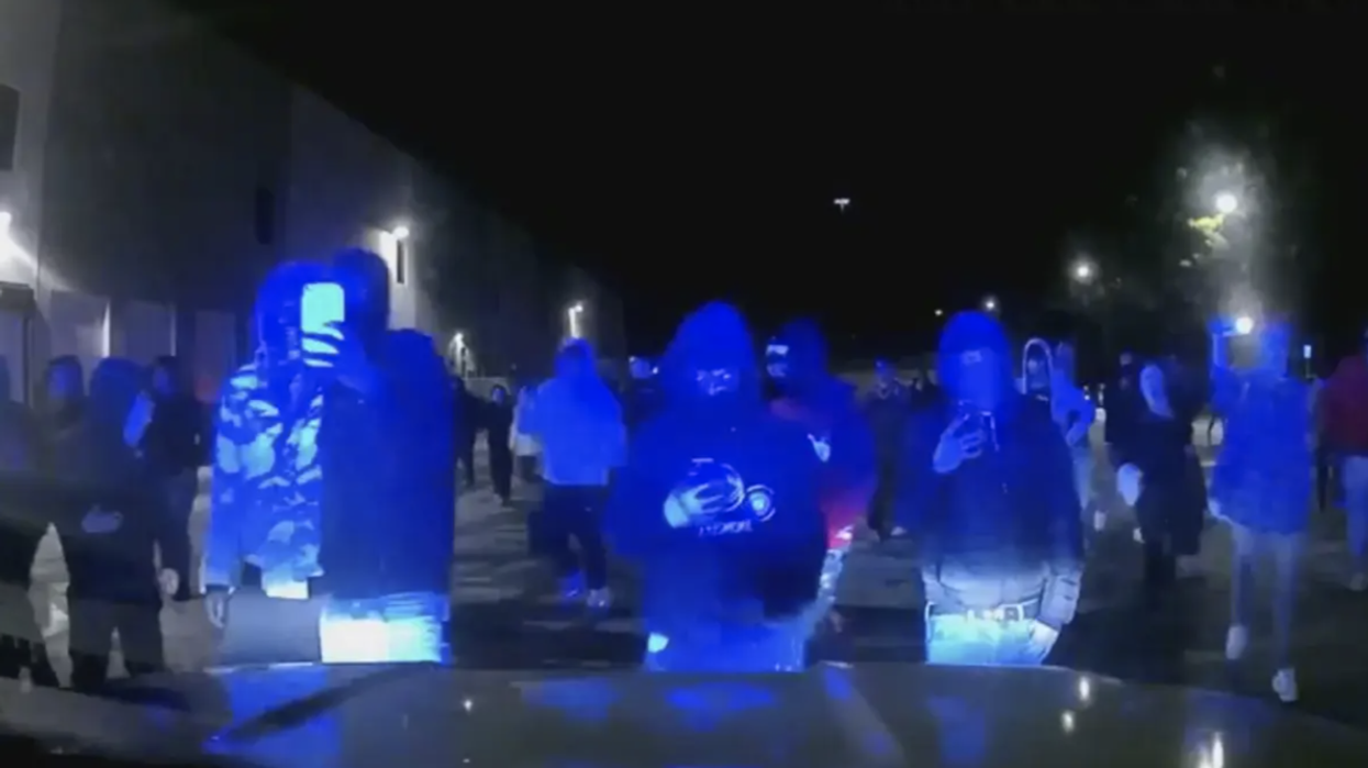 Alarming police bodycam video shows 'street takeover' where officer 'narrowly escaped line-of-duty death scenario'