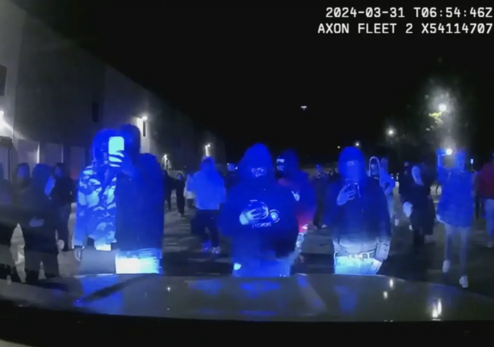 Alarming police bodycam video shows ';street takeover'; where officer ';narrowly escaped line-of-duty death scenario';