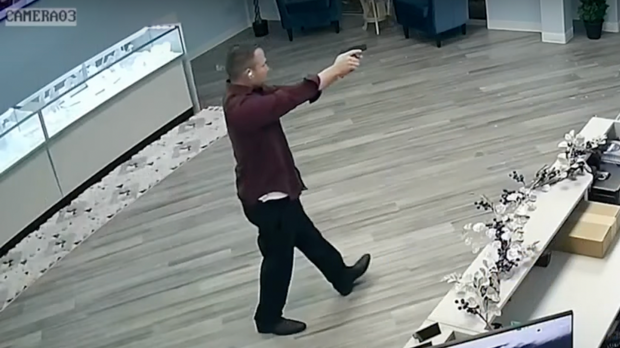 Video: Gun-toting jewelry store owner knows just what to do after burglar breaks in — and shocked crook makes hilarious exit