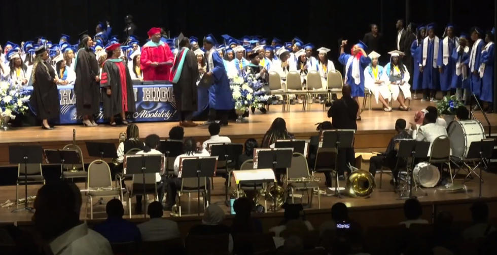 Brawl erupts during Tennessee high school graduation after a student throws up gang signs