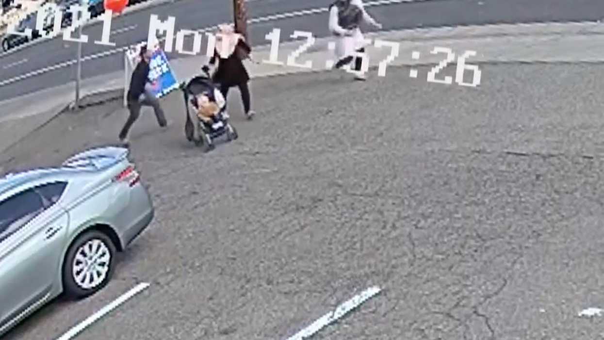 Insane video captures moment woman tries to kidnap baby in broad daylight — and then 2 Good Samaritans step in