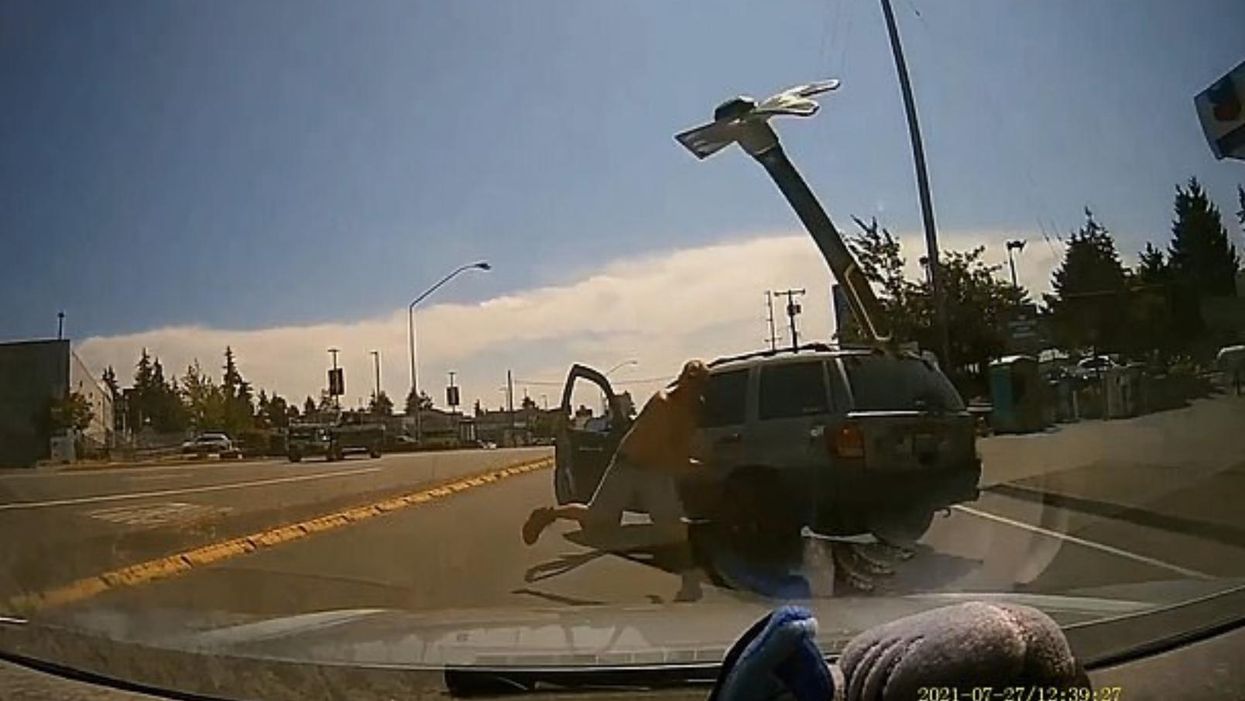 Insane video captures the moment a road rage suspect hurls pickaxe into a fellow driver's windshield