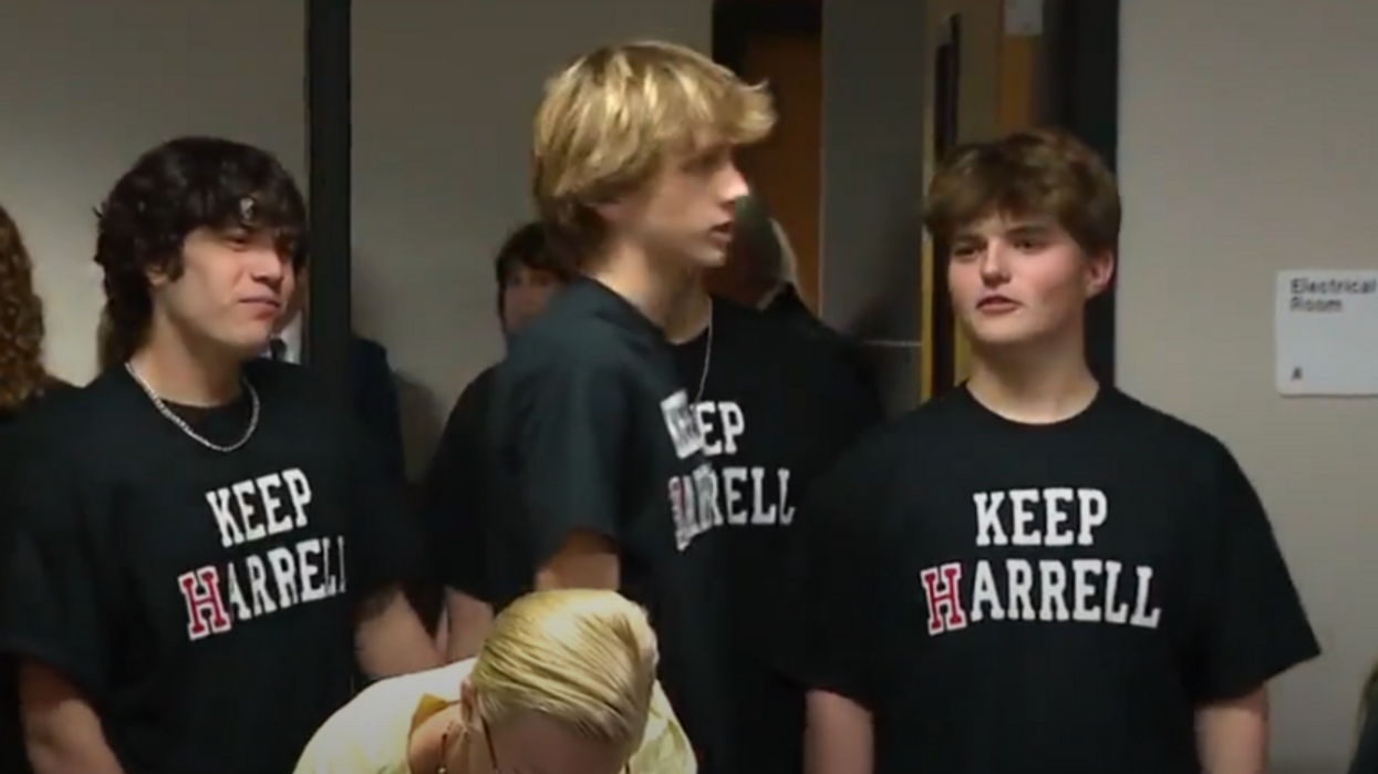 'Keep Harrell': Dozens of students show up to school board meeting to back football coach who was suspended for a 400-push-up punishment