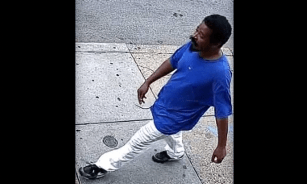Laughing 'piece of s**t' thug caught on video punching victim in face as pair pass each other in Philly crosswalk