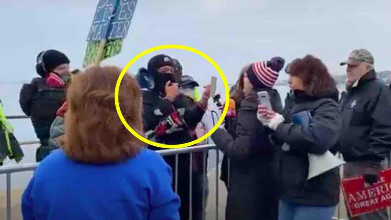 Left-wing activist, 32, accused of punching chest of 80-year-old woman rallying for President Trump after she tossed water on him