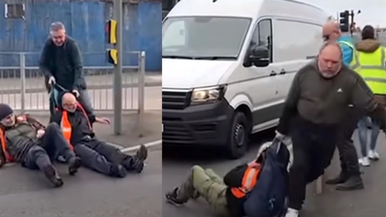 Left-wing activists blocking traffic in protest get dragged away by furious drivers: 'bunch of f***ing arseholes'