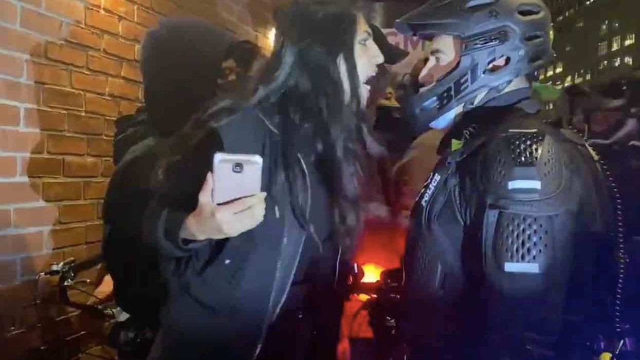 Leftist woman screams, 'F*** you, fascist!' at cop — then spits in his face. And boy, does she ever pay for it.