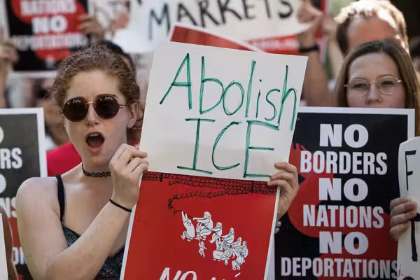 Liberal protesters dump ice into harbor on anniversary of Boston Tea Party to protest deportations