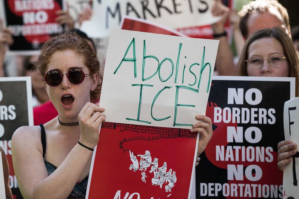 Liberal protesters dump ice into harbor on anniversary of Boston Tea Party to protest deportations