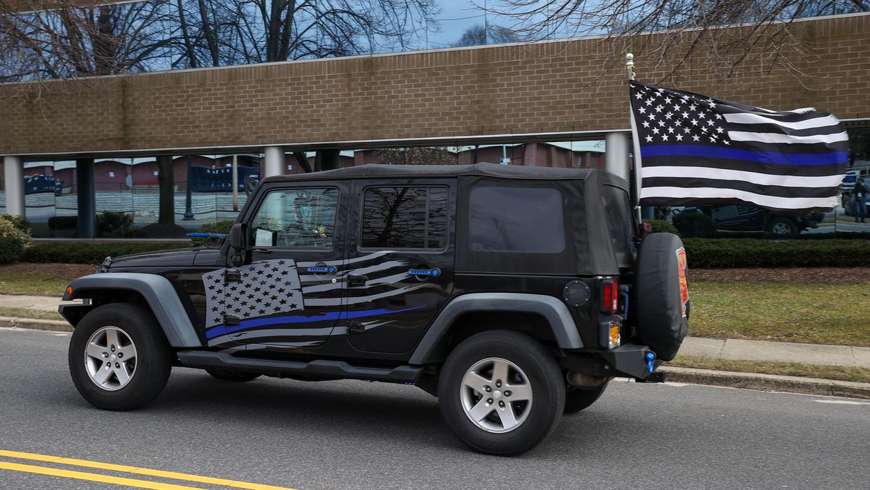 Library is sorry after using 'racist' thin blue line imagery to promote Northwestern University police reform event