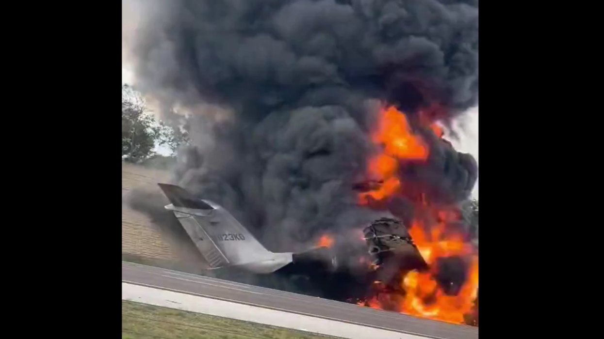 Luxury plane smashes onto Florida highway and goes up in flames after both engines stop working, killing 2