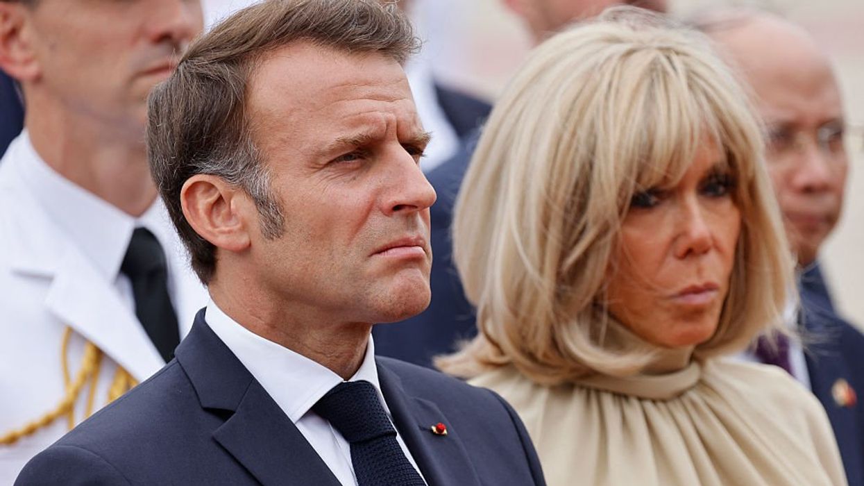 Macron's office initially denies authenticity of video showing French president's manhandling by his geriatric wife