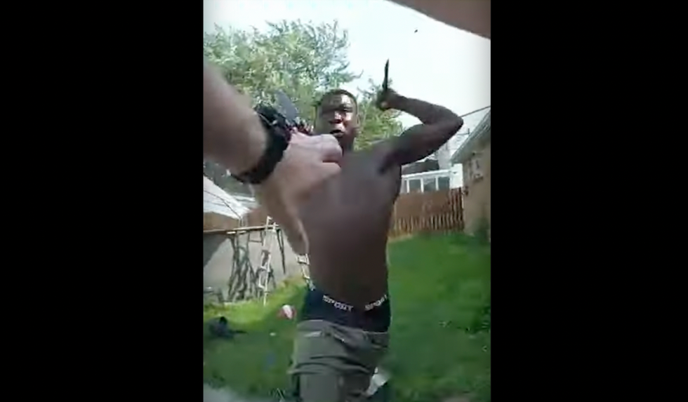 Male wielding 2 knives caught on police bodycam video jumping from window, running at cop, stabbing officer