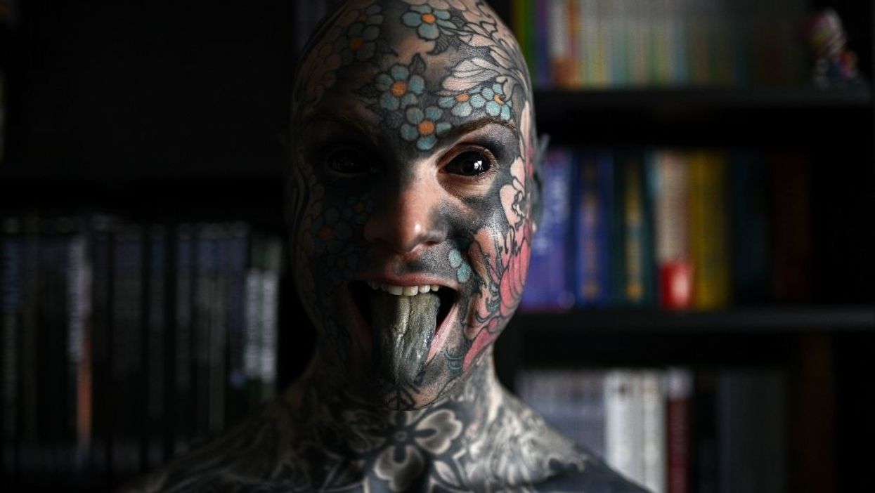 Man covered in tattoos with eyes surgically turned black upset he can't teach kindergarteners anymore