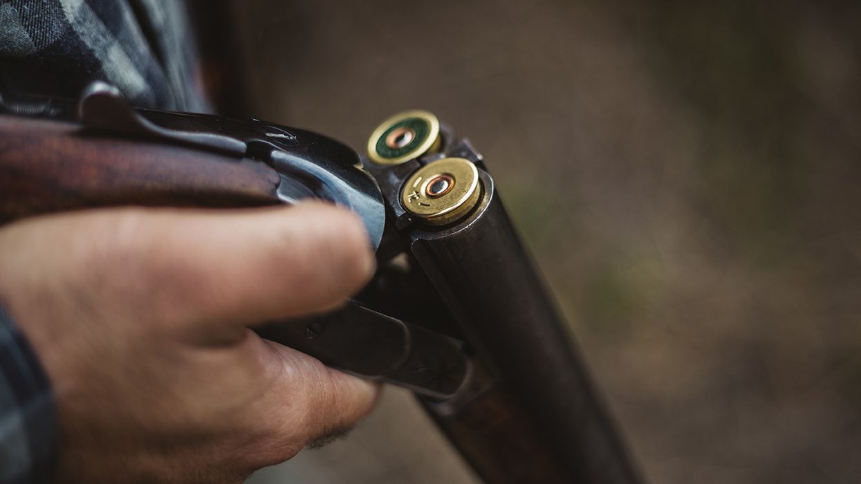 Man holding a shotgun