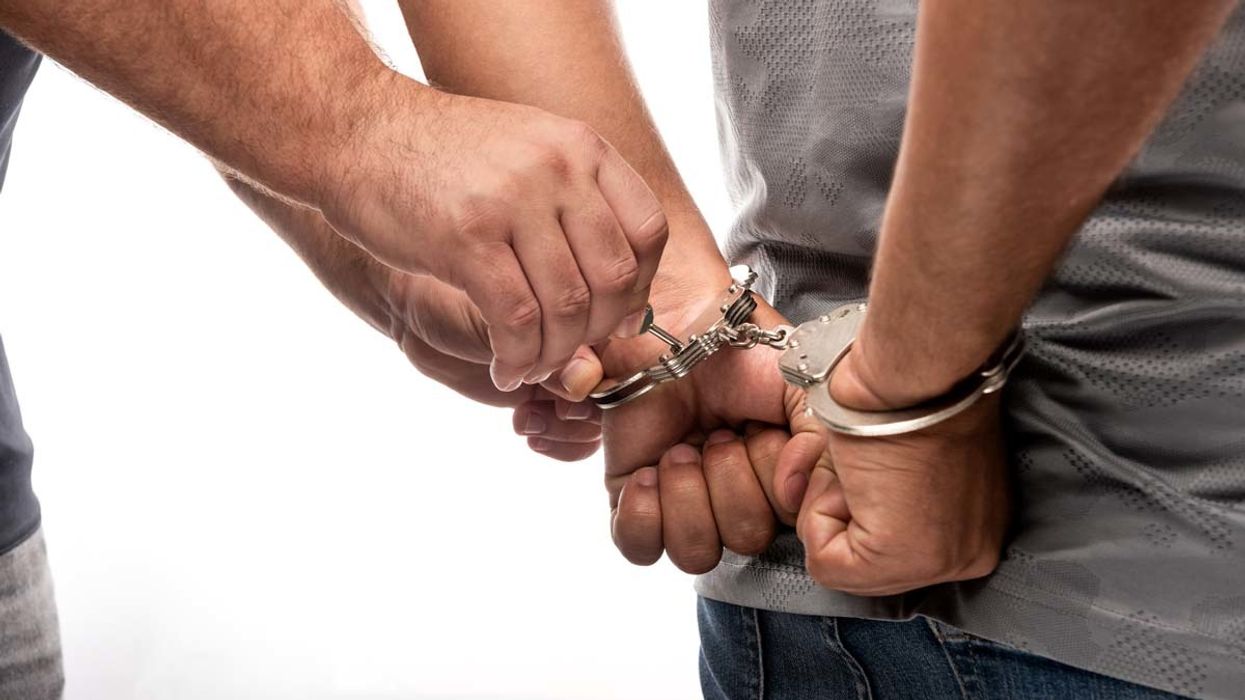Man unlocking handcuffs