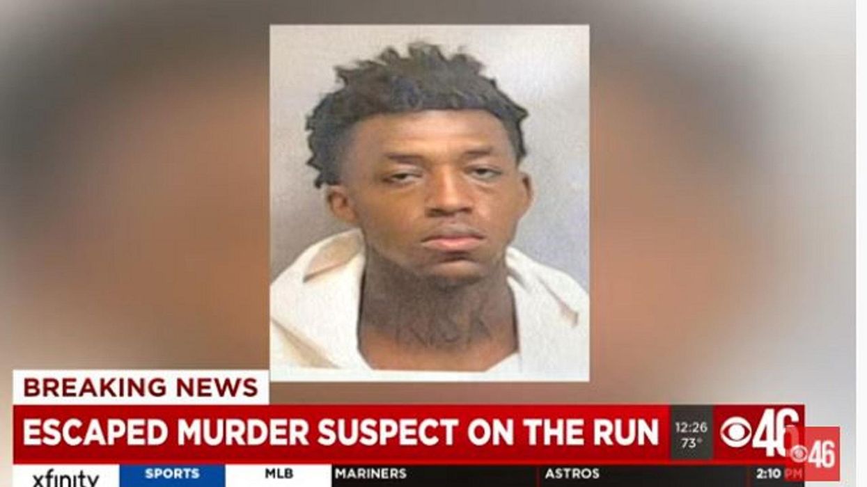 Manhunt underway for murder suspect who escaped custody at Atlanta airport, ran into woods