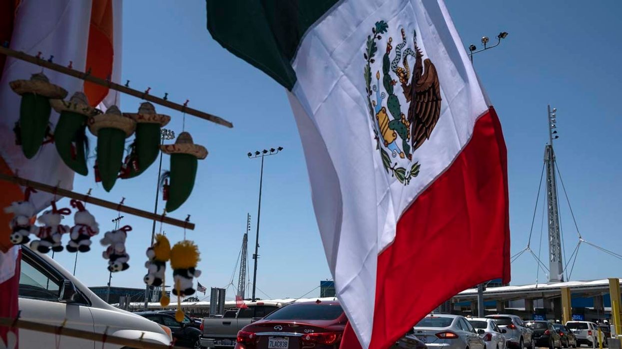 Mexico-U.S. border checkpoint and Mexican flag