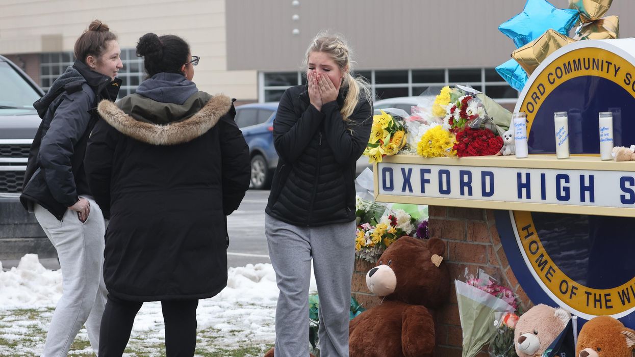 Michigan high school mass killing suspect may have been armed with a gun during disciplinary meeting with parents, school officials