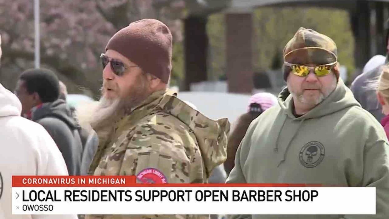 Michigan militia members say they won't allow police to arrest barber defying shutdown order