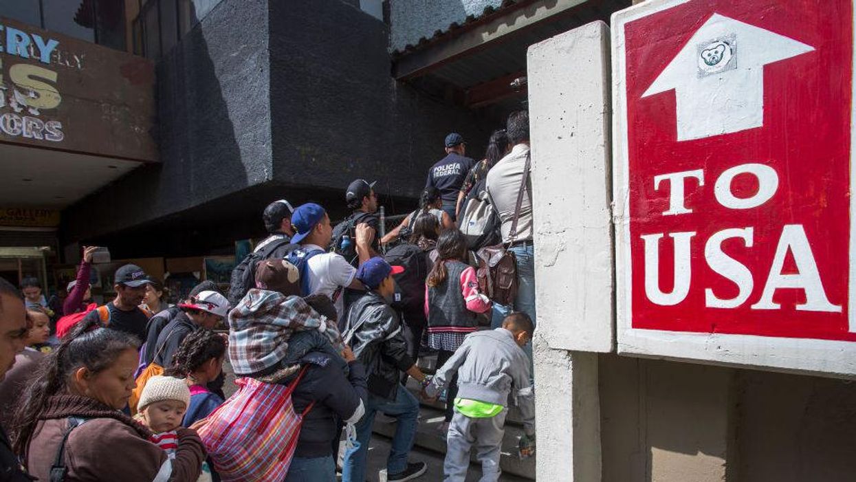 Migrant caravan heads for US, where immigrants hope to exploit Biden's reversal of Trump policies