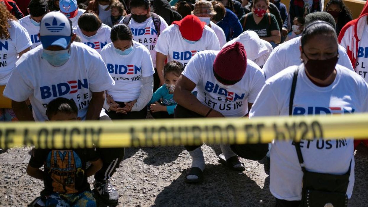 Migrants show up at southern border wearing Biden shirts saying, 'Please let us in!'
