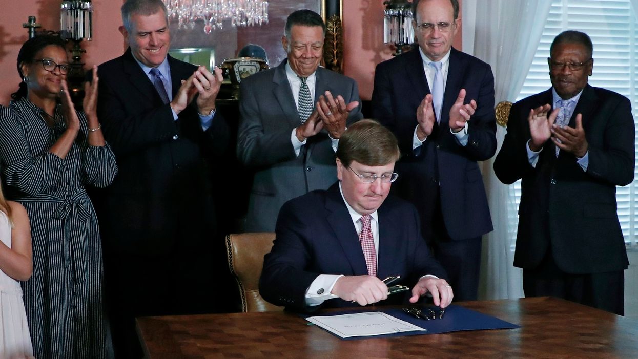 Mississippi Gov. Tate Reeves signs law retiring state flag to remove Confederate emblem