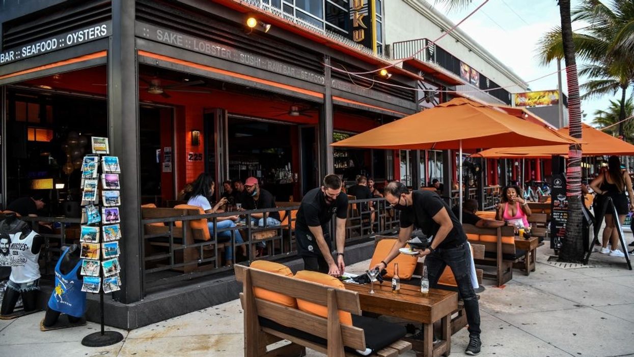 More Americans venture out in public, especially to restaurants, but the majority are staying home