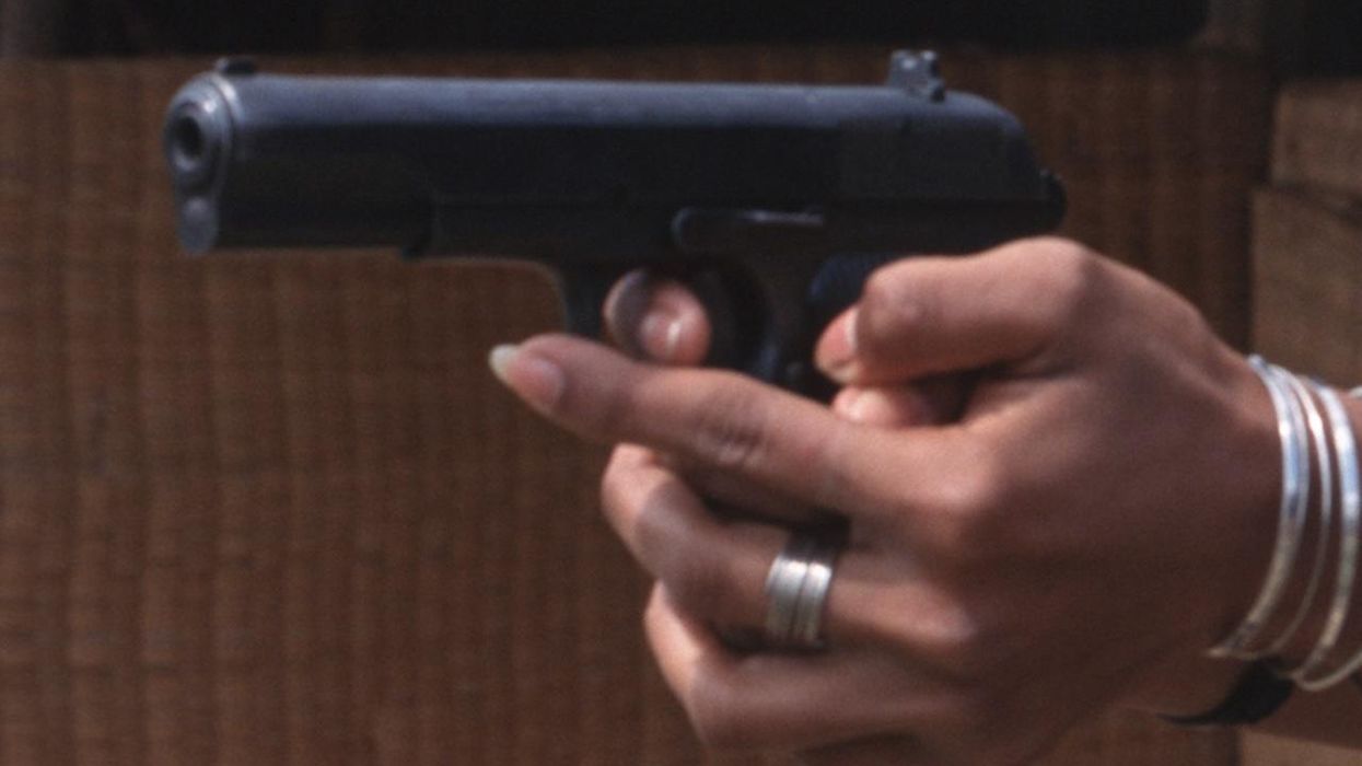 Mother protecting her young children fights, fatally shoots crook who forced his way into their home; he was on parole after 20 years in prison for armed robbery
