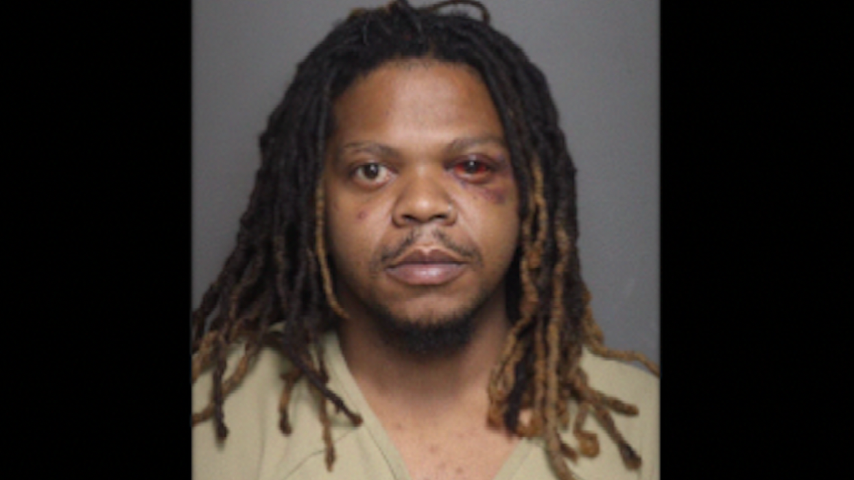 Motorist allegedly tries to run over trio standing on home's lawn after argument. Driver's downfall? One victim has a gun.