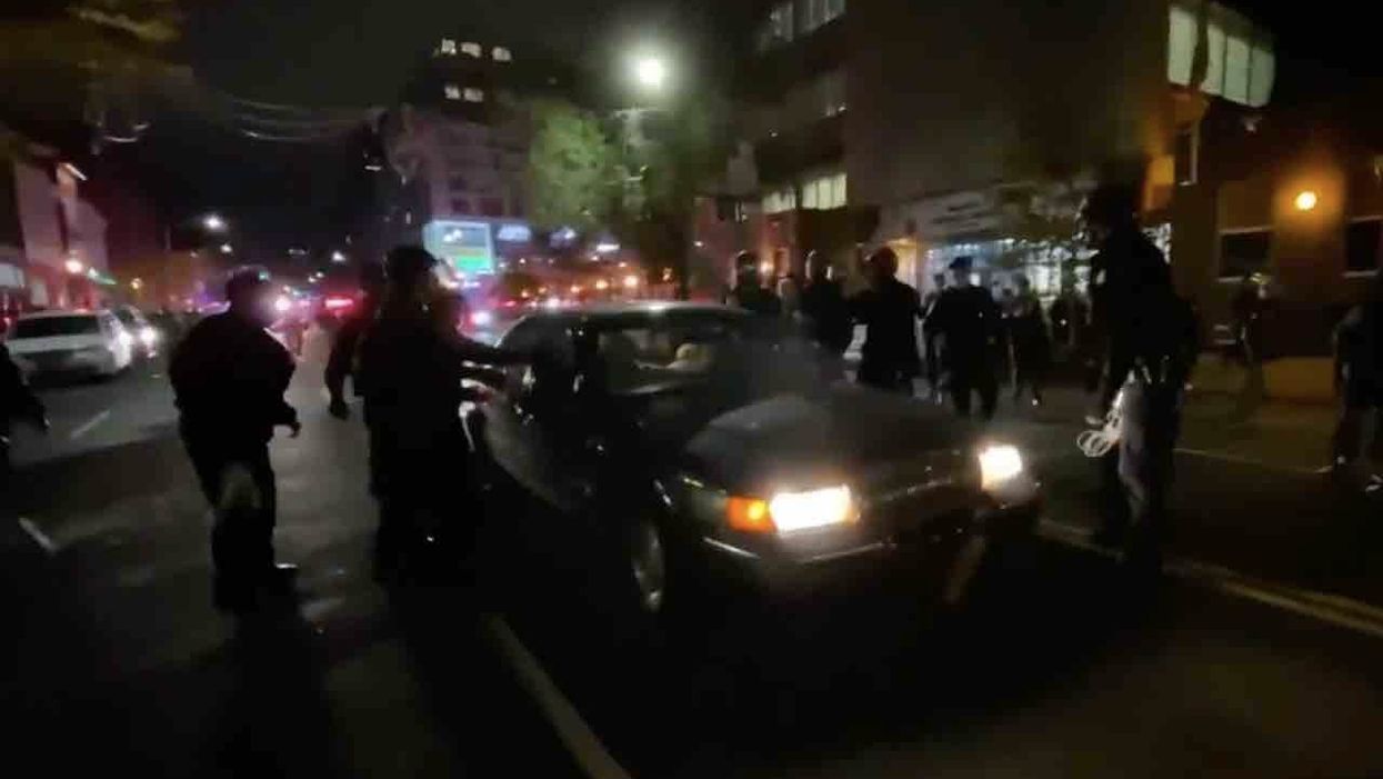 Motorist plows through line of cops after being ordered to stop amid Brooklyn rioting — and some Twitter users rejoice