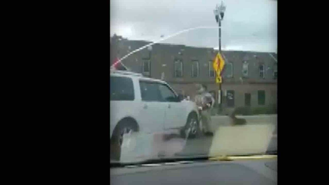 Motorist runs over Black Lives Matter supporter who refuses to get out of SUV's path — and cops charge suspect