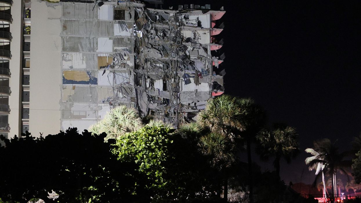 Multistory condo building partially collapses; hundreds of first responders flock to the scene to rescue the trapped