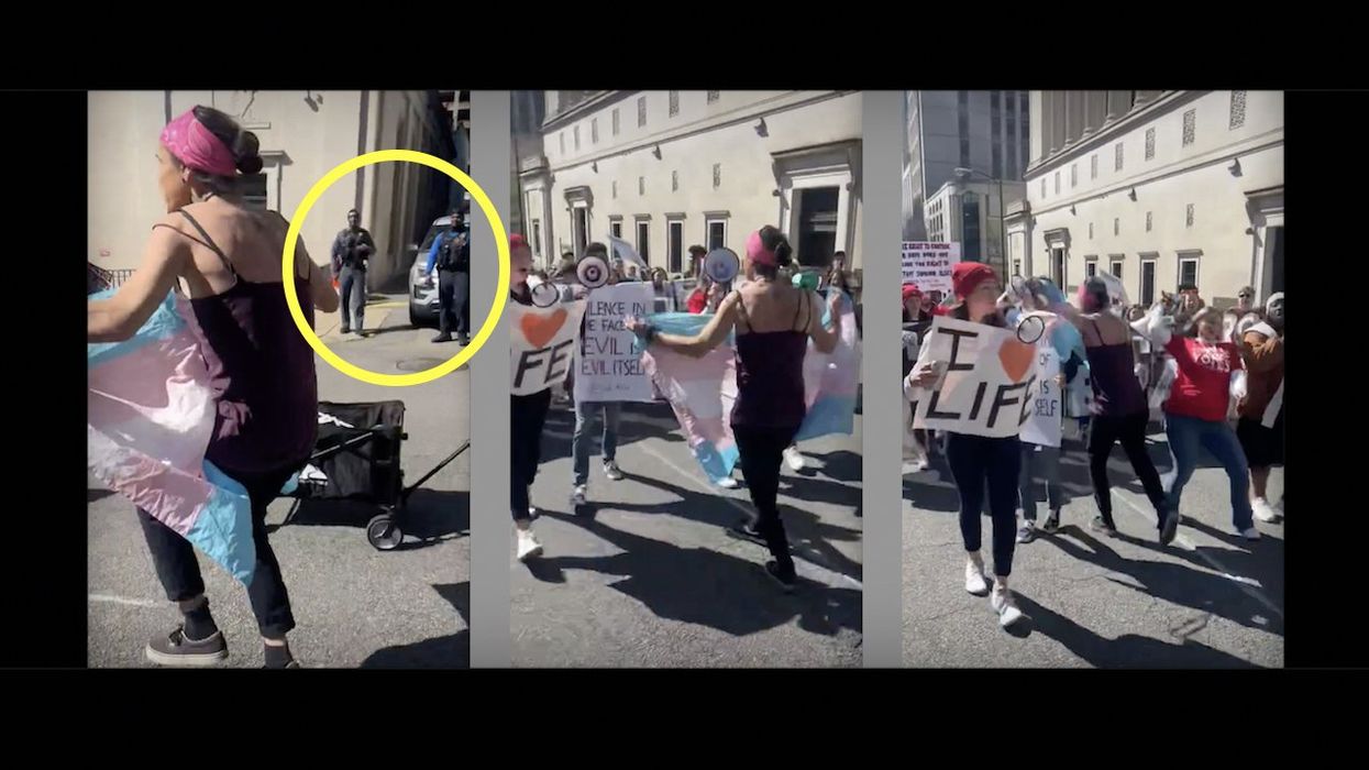 Muscular activist waving transgender flag slams into pro-life student marchers in front of cops; fails to get away unscathed