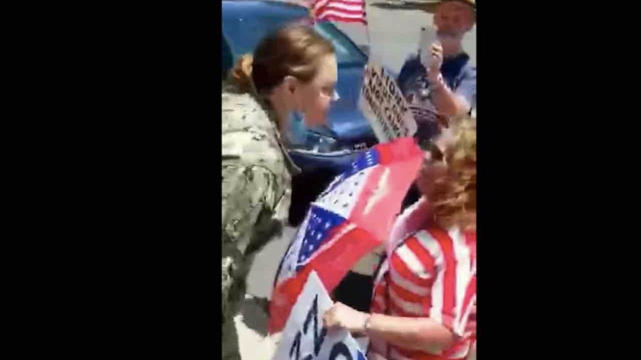 Naval petty officer caught on video screaming 'F*** Trump!' at flag-waving rally attendees