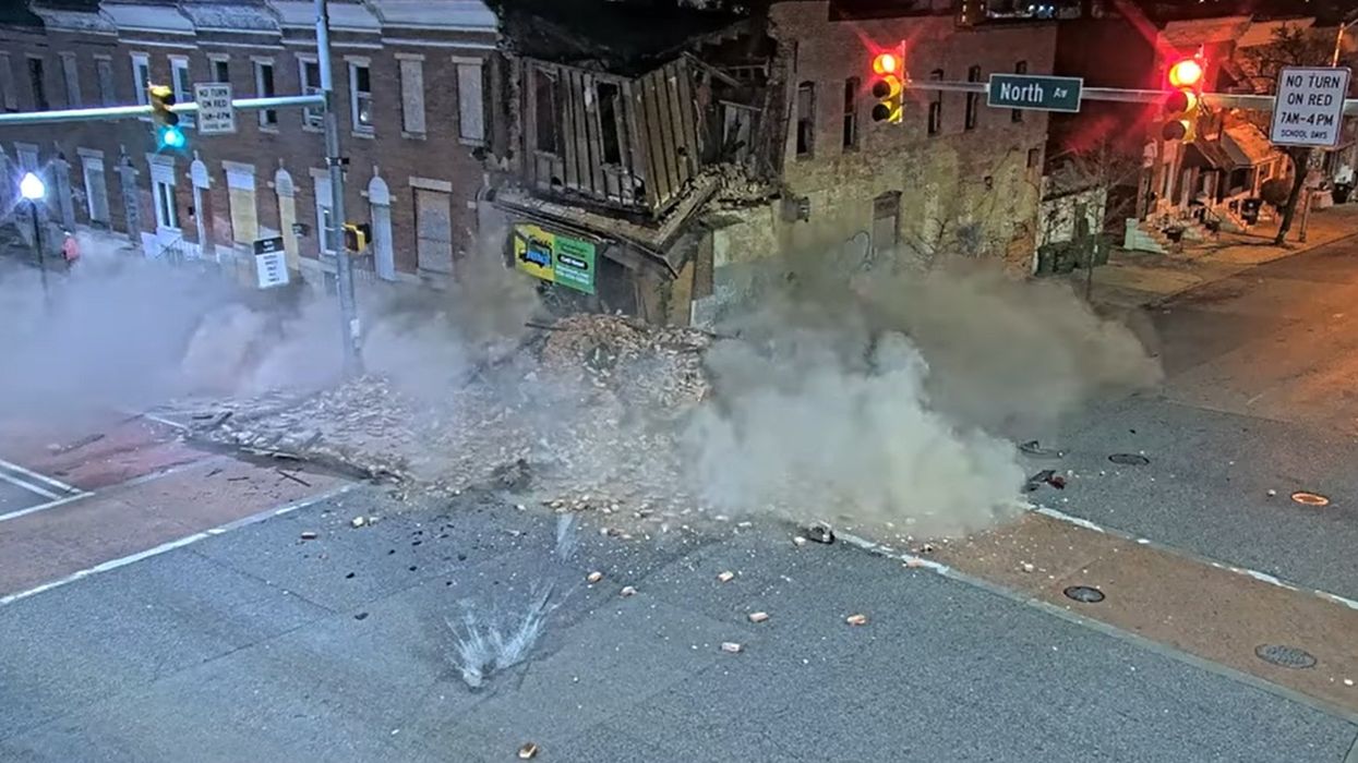 Newly released footage shows horrific moment a suspect fleeing police in stolen vehicle smashed into a sedan, bringing down a building