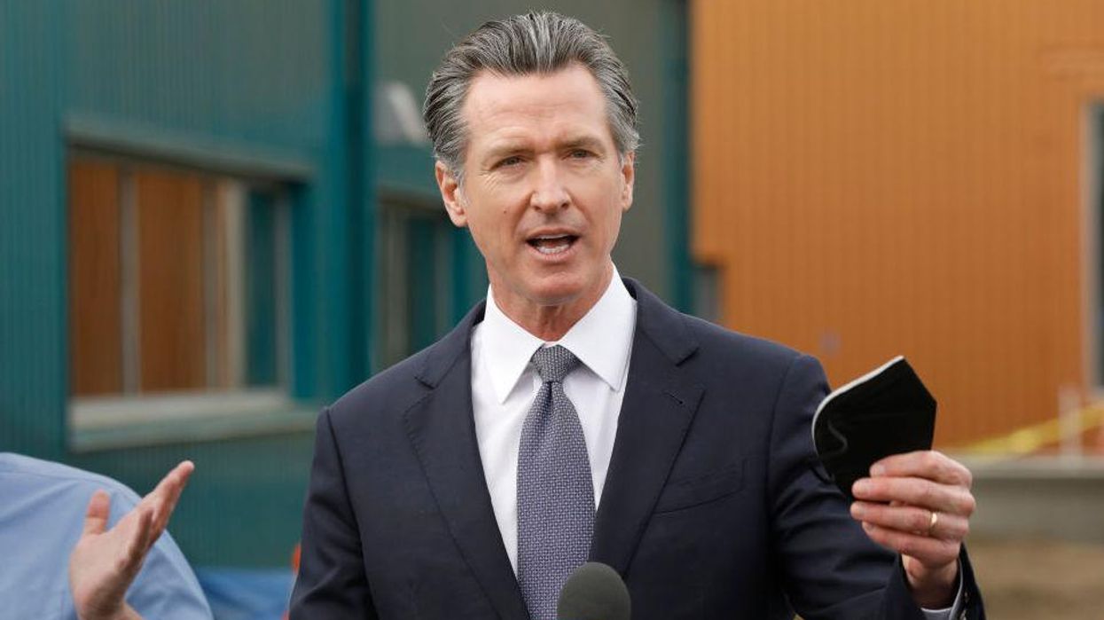 Newsom claims he removed mask for 'brief second' to snap photo with NBA legend. Photo evidence shows otherwise.